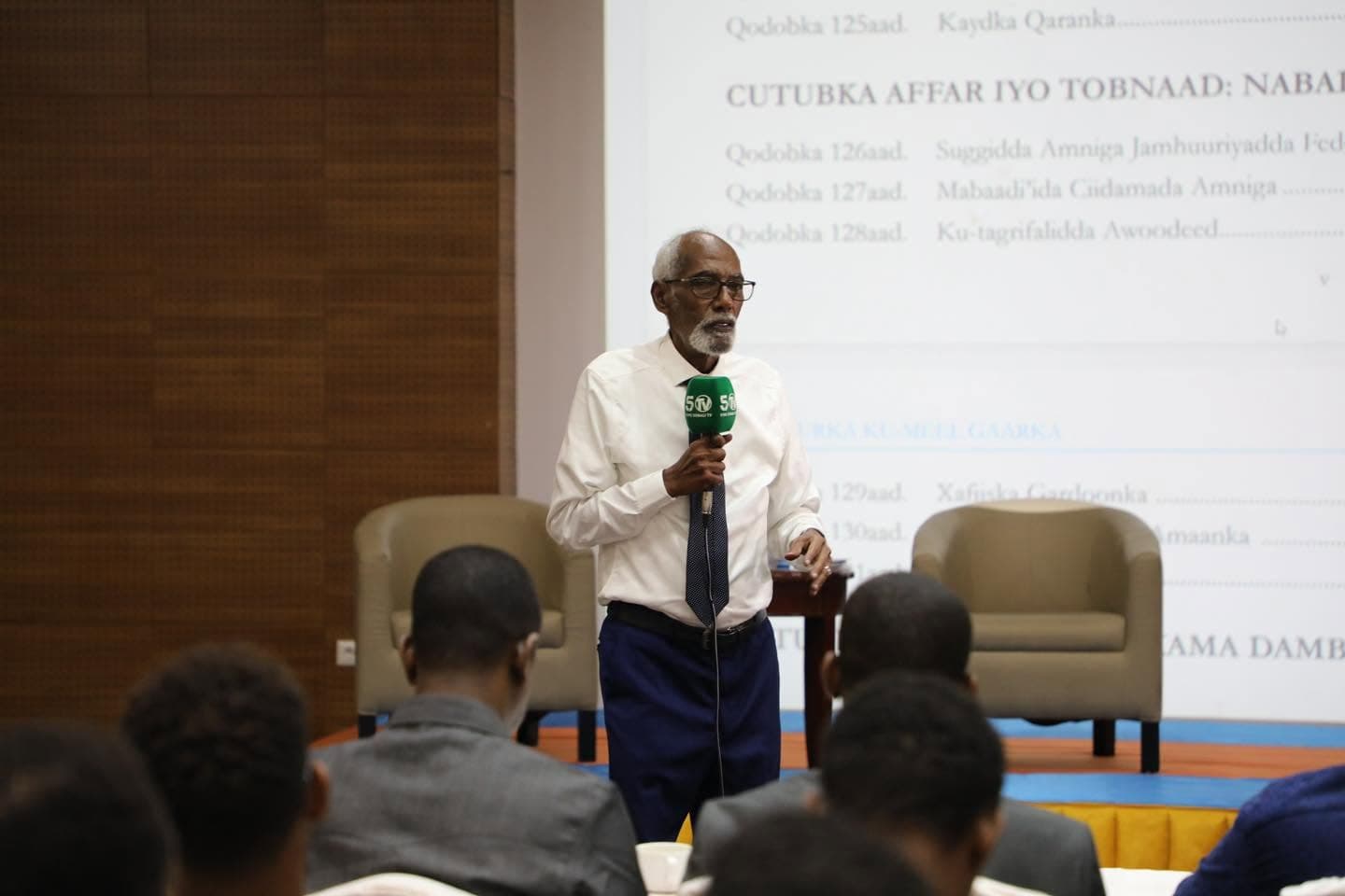 Community elder addressing a Minbar forum